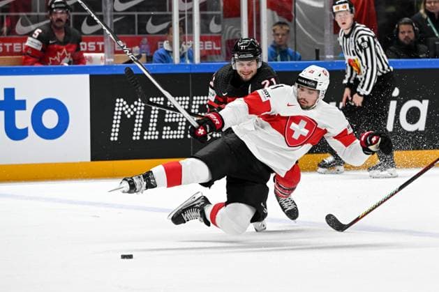 RIGA, LATVIA - MAY 20: Kevin Fiala of Switzerland battles for the puck against Scott Laughton of Canada during the 2023 IIHF Ice hockey, Eishockey World Championship, WM, Weltmeisterschaft Finland - Latvia game between Canada Switzerland at Arena Riga on May 20, 2023 in Riga, Latvia. Riga Arena Riga Latvia Copyright: xJustPictures.ch AndreaxBrancax