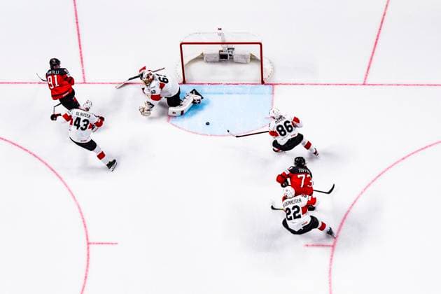RIGA, LATVIA - MAY 20: Janis Moser of Switzerland (L) helping goalkeeper Leonardo Genoni of Switzerland during the 2023 IIHF Ice hockey, Eishockey World Championship, WM, Weltmeisterschaft Finland - Latvia game between Canada Switzerland at Arena Riga on May 20, 2023 in Riga, Latvia. Riga Arena Riga Latvia Copyright: xJustPictures.ch JarixPestelaccix