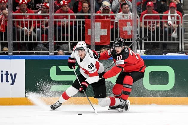 RIGA, LATVIA - MAY 20: Marco Miranda of Switzerland battles for the puck possession against Justin Barron of Canada during the 2023 IIHF Ice hockey, Eishockey World Championship, WM, Weltmeisterschaft Finland - Latvia game between Canada Switzerland at Arena Riga on May 20, 2023 in Riga, Latvia. Riga Arena Riga Latvia Copyright: xJustPictures.ch AndreaxBrancax