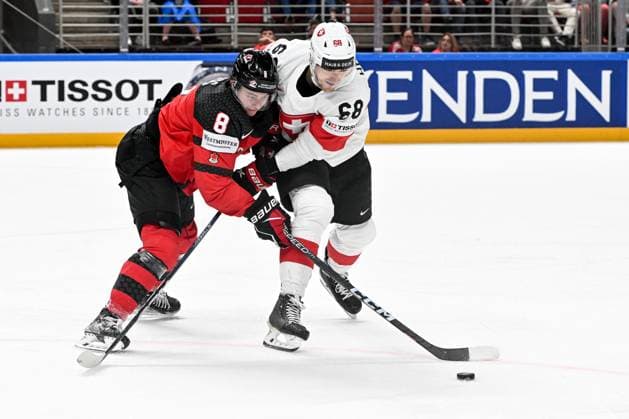RIGA, LATVIA - MAY 20: Fabrice Herzog of Switzerland and Cody Glass of Canada battle for the puck during the 2023 IIHF Ice hockey, Eishockey World Championship, WM, Weltmeisterschaft Finland - Latvia game between Canada Switzerland at Arena Riga on May 20, 2023 in Riga, Latvia. Riga Arena Riga Latvia Copyright: xJustPictures.ch AndreaxBrancax