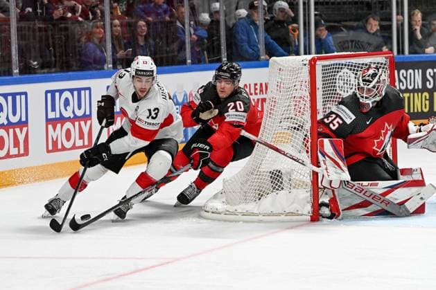 RIGA, LATVIA - MAY 20: Nico Hischier of Switzerland in action against Justin Barron of Canada and goalkeeper Samuel Montembeault of Canada during the 2023 IIHF Ice hockey, Eishockey World Championship, WM, Weltmeisterschaft Finland - Latvia game between Canada Switzerland at Arena Riga on May 20, 2023 in Riga, Latvia. Riga Arena Riga Latvia Copyright: xJustPictures.ch AndreaxBrancax