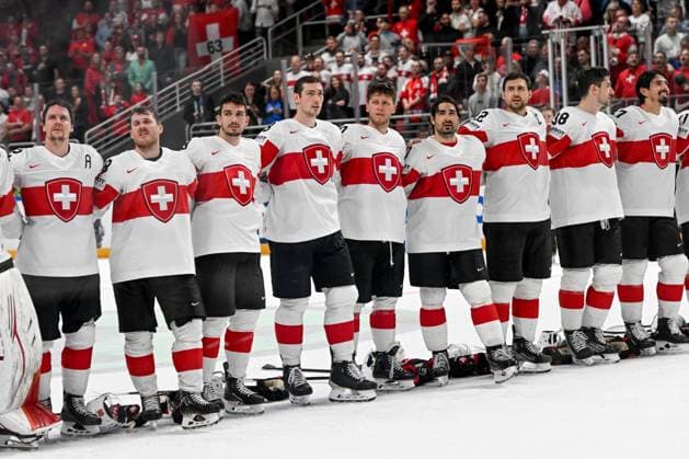 RIGA, LATVIA - MAY 20: Swiss players listen to the national anthem during the 2023 IIHF Ice hockey, Eishockey World Championship, WM, Weltmeisterschaft Finland - Latvia game between Canada Switzerland at Arena Riga on May 20, 2023 in Riga, Latvia. Riga Arena Riga Latvia Copyright: xJustPictures.ch AndreaxBrancax