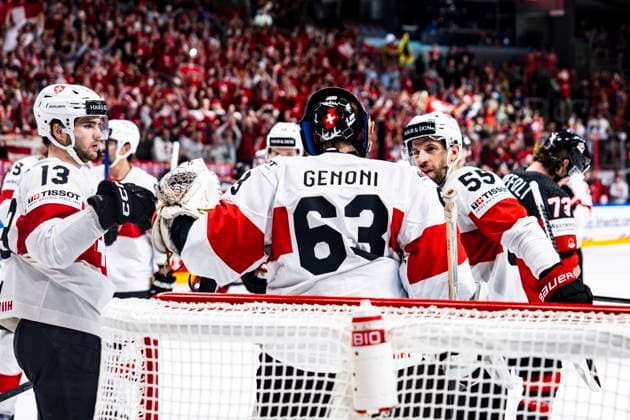 RIGA, LATVIA - MAY 20: Nico Hischier of Switzerland (L) and Romain Loeffel of Switzerland (R) celebrates victory with goalkeeper Leonardo Genoni of Switzerland (C) during the 2023 IIHF Ice hockey, Eishockey World Championship, WM, Weltmeisterschaft Finland - Latvia game between Canada Switzerland at Arena Riga on May 20, 2023 in Riga, Latvia. Riga Arena Riga Latvia Copyright: xJustPictures.ch JarixPestelaccix
