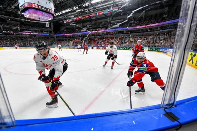 RIGA, LATVIA - MAY 22: Samuel Blais of Canada fight with Mathias Trettenes of Norway for the puck possession during the 2023 IIHF Ice hockey, Eishockey World Championship, WM, Weltmeisterschaft Finland - Latvia game between Canada and Norway at Arena Riga on May 22, 2023 in Riga, Latvia. Riga Arena Riga Latvia Copyright: xJustPictures.ch AndreaxBrancax