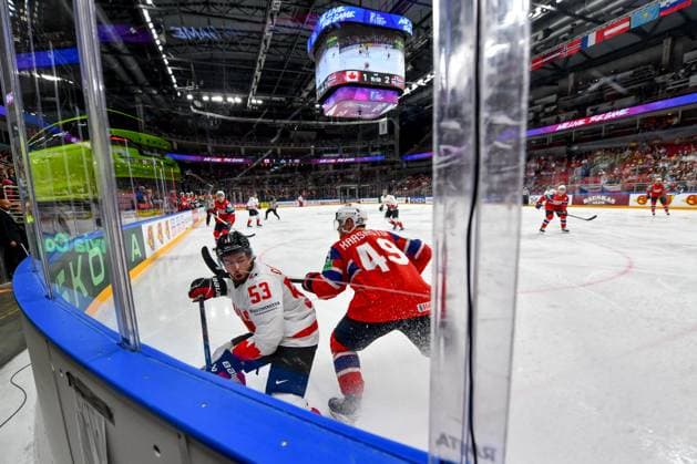 RIGA, LATVIA - MAY 22: Michael Carcone of Canada battle along the boards against Christian Kaasastul of Norway during the 2023 IIHF Ice hockey, Eishockey World Championship, WM, Weltmeisterschaft Finland - Latvia game between Canada and Norway at Arena Riga on May 22, 2023 in Riga, Latvia. Riga Arena Riga Latvia Copyright: xJustPictures.ch AndreaxBrancax