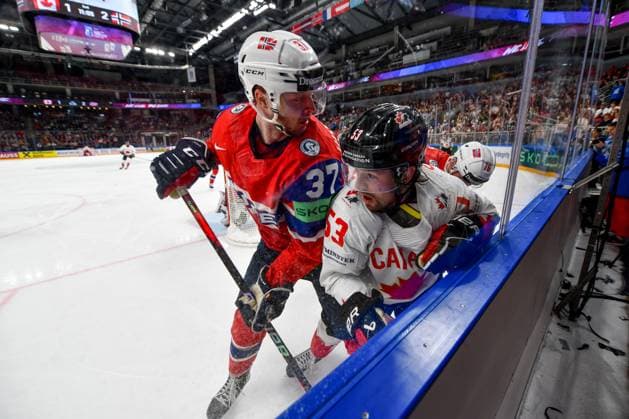 RIGA, LATVIA - MAY 22: Michael Carcone of Canada and Markus Vikingstad of Norway battle along the boards during the 2023 IIHF Ice hockey, Eishockey World Championship, WM, Weltmeisterschaft Finland - Latvia game between Canada and Norway at Arena Riga on May 22, 2023 in Riga, Latvia. Riga Arena Riga Latvia Copyright: xJustPictures.ch AndreaxBrancax