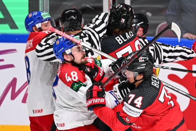 From left Czech Jiri Cernoch, Ethan Bear of Canada fight during the IIHF Ice hockey, Eishockey World Championship, WM, Weltmeisterschaft Group B match Czech Republic vs Canada, in Riga, Latvia, May 23, 2023. (CTKxPhoto DavidxTanecek) CTKPhotoP2023052307887  CTKPhotoP2023052307887