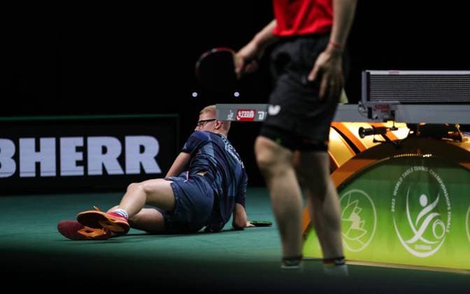 Sport Themen der Woche KW21 (230525) -- DURBAN, May 25, 2023 -- Felix Lebrun of France falls down on the floor during the men s singles third round match between Qiu Dang of Germany and Felix Lebrun of France at 2023 ITTF Table tennis, Tischtennis World Championships Finals in Durban, South Africa, May 24, 2023. ) (SP)SOUTH AFRICA-DURBAN-ITTF-TABLE TENNIS-WORLD CHAMPIONSHIPS FINALS-DAY 5 HanxXu 