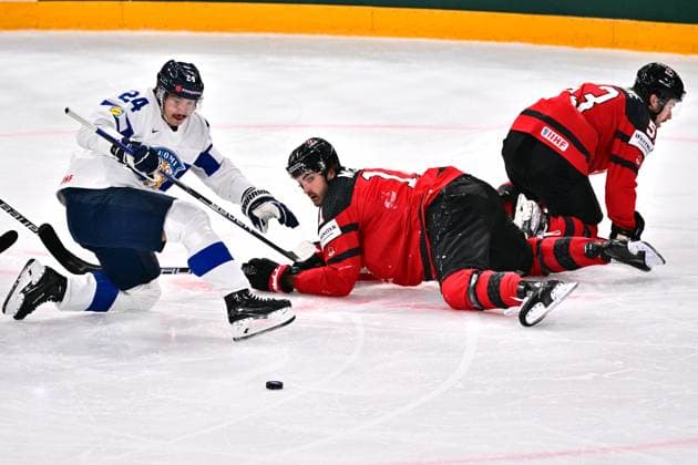 L-R Hannes Bjorninen (FIN), Jack McBain (CAN) and Michael Carcone (CAN) in action during the quarter-final match Canada vs Finland, within the IIHF Ice hockey, Eishockey World Championship, WM, Weltmeisterschaft on May 24, 2023, in Tampere, Finland. (CTKxPhoto DavidxTanecek) CTKPhotoP2023052509291  CTKPhotoP2023052509291