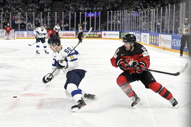 Miika Koivisto (L) of Finland and Michael Carcone of Canada during the 2023 IIHF Ice hockey, Eishockey World Championships quarterfinal match between Canada and Finland in Tampere on May 25, 2023. Tampere Finland LKFTJK20230525211734CJAM  Copyright: xEmmixKorhonenx LKFTJK20230525211734CJAM