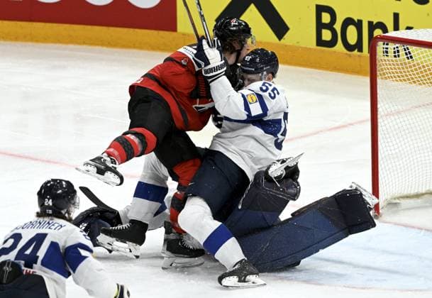 Tyler Toffoli of USA and Finland s Atte Ohtamaa (55) fall on goalkeeper Emil Larmi of Finland during the 2023 IIHF Ice hockey, Eishockey World Championships quarterfinal match between Canada and Finland in Tampere on May 25, 2023. Tampere Finland LKFTJK20230525220609ICWA  Copyright: xJussixNukarix LKFTJK20230525220609ICWA