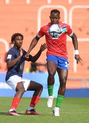 (230526) -- MENDOZA, May 26, 2023 -- Ebrima Singhateh (R) of Gambia vies with Jordan Semedo Varela of France during the FIFA U20 World Cup group F match between France and Gambia in Mendoza, Argentina, May 25, 2023. ( Handout via Xinhua) (SP)ARGENTINA-MENDOZA-FOOTBALL-2023 FIFA U-20 WORLD CUP-FRANCE VS GAMBIA TELAM 