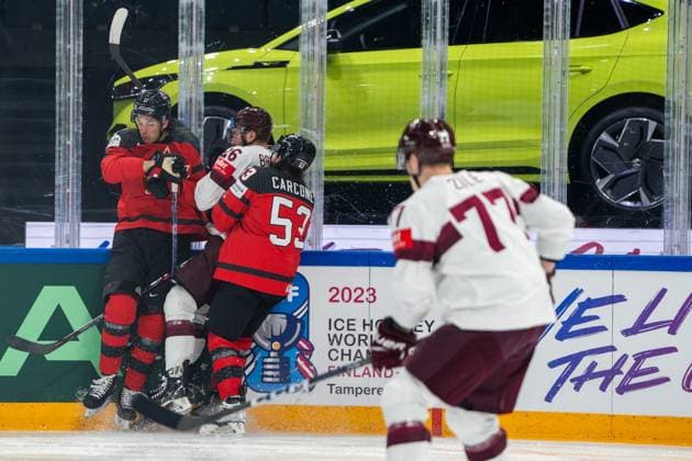 RIGA, LATVIA - MAY 27: Uvis Janis Balinskis of Latvia (2nd from L) closed between Jack Mcbain of Canada (L) and Michael Carcone of Canada (C) during the 2023 IIHF Ice hockey, Eishockey World Championship, WM, Weltmeisterschaft Finland - Latvia game between Canada and Latvia at Nokia Arena on May 27, 2023 in Tampere, Finland. Tampere Finland Copyright: xJustPictures.ch JarixPestelaccix