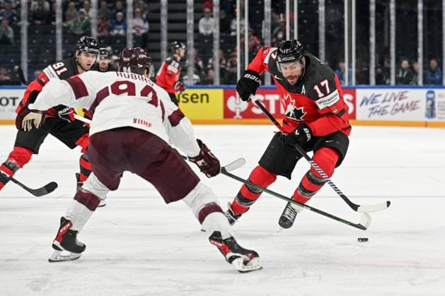 RIGA, LATVIA - MAY 27: Milan Lucic of Canada enters the offensive zone against Kristians Rubins of Latvia during the 2023 IIHF Ice hockey, Eishockey World Championship, WM, Weltmeisterschaft Finland - Latvia game between Canada and Latvia at Nokia Arena on May 27, 2023 in Tampere, Finland. Tampere Finland Copyright: xJustPictures.ch AndreaxBrancax