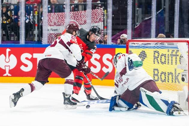 RIGA, LATVIA - MAY 27: Samuel Blais of Canada (C) blocked by Uvis Janis Balinskis of Latvia (L) during the 2023 IIHF Ice hockey, Eishockey World Championship, WM, Weltmeisterschaft Finland - Latvia game between Canada and Latvia at Nokia Arena on May 27, 2023 in Tampere, Finland. Tampere Finland Copyright: xJustPictures.ch JarixPestelaccix
