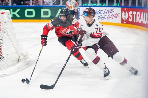 RIGA, LATVIA - MAY 27: Miks Indrasis of Latvia (R) chased by Pierre-Olivier Joseph of Canada (L) during the 2023 IIHF Ice hockey, Eishockey World Championship, WM, Weltmeisterschaft Finland - Latvia game between Canada and Latvia at Nokia Arena on May 27, 2023 in Tampere, Finland. Tampere Finland Copyright: xJustPictures.ch JarixPestelaccix