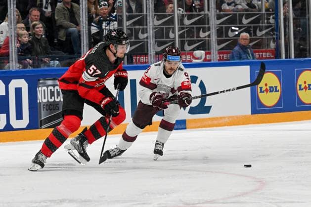 RIGA, LATVIA - MAY 27: Renars Krastenbergs of Latvia fights for the puck against Tyler Myers of Canada during the 2023 IIHF Ice hockey, Eishockey World Championship, WM, Weltmeisterschaft Finland - Latvia game between Canada and Latvia at Nokia Arena on May 27, 2023 in Tampere, Finland. Tampere Finland Copyright: xJustPictures.ch AndreaxBrancax