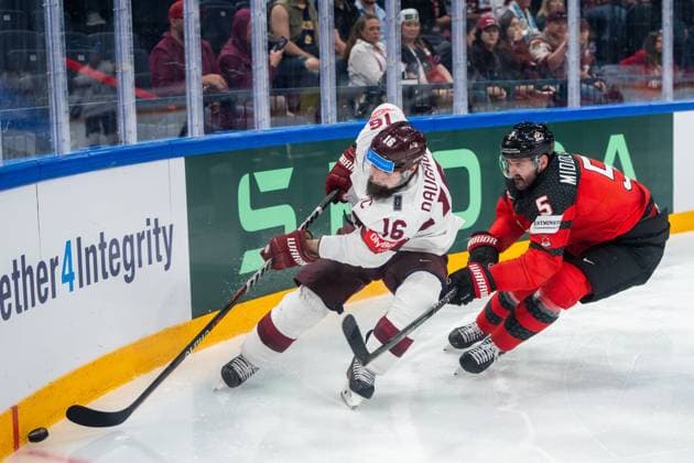 RIGA, LATVIA - MAY 27: Kaspars Daugavins of Latvia (L) against Jacob Middleton of Canada (R) during the 2023 IIHF Ice hockey, Eishockey World Championship, WM, Weltmeisterschaft Finland - Latvia game between Canada and Latvia at Nokia Arena on May 27, 2023 in Tampere, Finland. Tampere Finland Copyright: xJustPictures.ch JarixPestelaccix