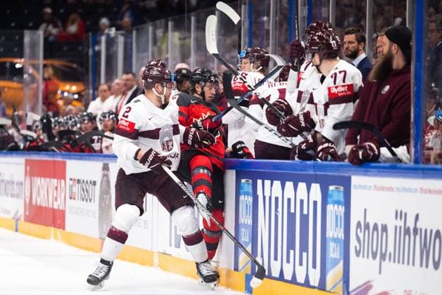 230527 Karlis Cukste of Latvia and Jake Neighbours of Canada during the 2023 IIHF Ice hockey, Eishockey World Championship, WM, Weltmeisterschaft semifinal game between Canada and Latvia on May 27, 2023 in Tampere. Photo: Joel Marklund BILDBYRAN kod JM JM0485 bbeng ishockey ice hockey ishockey-vm 2023 ishockey-vm vm 2023 iihf ice hockey world championship semifinal semi-final kanada canada latvia lettland Copyright: JOELxMARKLUND BB230527JM048
