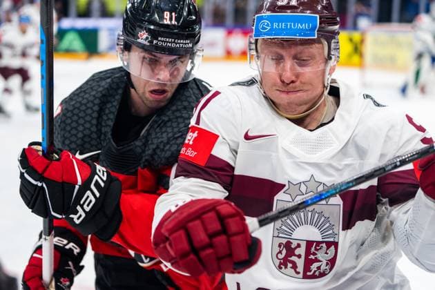 RIGA, LATVIA - MAY 27: Adam Fantilli of Canada (L) against Ronalds Kenins of Latvia (R) during the 2023 IIHF Ice hockey, Eishockey World Championship, WM, Weltmeisterschaft Finland - Latvia game between Canada and Latvia at Nokia Arena on May 27, 2023 in Tampere, Finland. Tampere Finland Copyright: xJustPictures.ch JarixPestelaccix