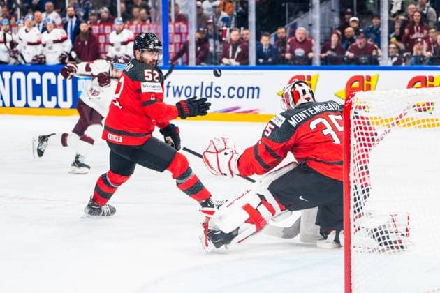 RIGA, LATVIA - MAY 27: MacKenzie Weegar of Canada (L) deflect a shot in front of goalkeeper Samuel Montembeault of Canada (R) during the 2023 IIHF Ice hockey, Eishockey World Championship, WM, Weltmeisterschaft Finland - Latvia game between Canada and Latvia at Nokia Arena on May 27, 2023 in Tampere, Finland. Tampere Finland Copyright: xJustPictures.ch JarixPestelaccix
