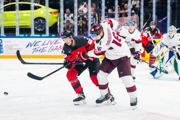 RIGA, LATVIA - MAY 27: Kaspars Daugavins of Latvia (R) against Jack Quinn of Canada (L) during the 2023 IIHF Ice hockey, Eishockey World Championship, WM, Weltmeisterschaft Finland - Latvia game between Canada and Latvia at Nokia Arena on May 27, 2023 in Tampere, Finland. Tampere Finland Copyright: xJustPictures.ch JarixPestelaccix