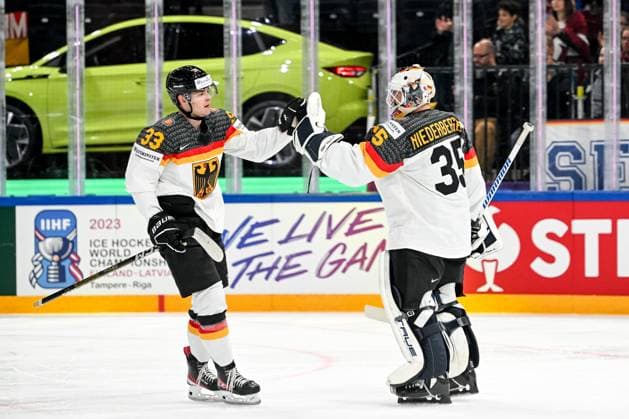 Eishockey, WM, Finale, Kanada - Deutschland TAMPERE, FINLAND - MAY 28: John Peterka of Germany (L) celebrate after scoring a goal with teammate goalkeeper Mathias Niederberger of Germany (R) during the 2023 IIHF Ice hockey, Eishockey World Championship, WM, Weltmeisterschaft Finland - Latvia game between Canada and Germany at Nokia Arena on May 28, 2023 in Tampere, Finland. Tampere Nokia Arena Finland Copyright: xJustPictures.ch AndreaxBrancax