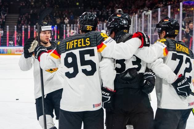Eishockey, WM, Finale, Kanada - Deutschland TAMPERE, FINLAND - MAY 28: Moritz Seider of Germany (L) joins Frederik Tiffels of Germany (2nd from L), Dominik Kahun of Germany (R) celebrating John Peterka of Germany (C) during the 2023 IIHF Ice hockey, Eishockey World Championship, WM, Weltmeisterschaft Finland - Latvia game between Canada and Germany at Nokia Arena on May 28, 2023 in Tampere, Finland. Tampere Nokia Arena Finland Copyright: xJustPictures.ch JarixPestelaccix