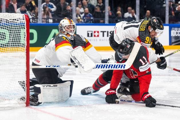 230528 Goaltender Mathias Niederberger and Moritz Müller of Germany and Jack McBain of Canada during the 2023 IIHF Ice hockey, Eishockey World Championship, WM, Weltmeisterschaft final game between Canada and Germany on May 28, 2023 in Tampere. Photo: Joel Marklund BILDBYRAN kod JM JM0489 bbeng ishockey ice hockey ishockey-vm 2023 ishockey-vm vm 2023 iihf ice hockey world championship final kanada canada germany tyskland Copyright: JOELxMARKLUND BB230528JM130