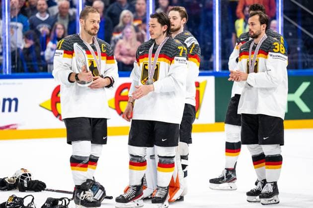 230528 Moritz Müller and Daniel Fischbuch of Germany with the trophy for second place in the 2023 IIHF Ice hockey, Eishockey World Championship, WM, Weltmeisterschaft final game between Canada and Germany on May 28, 2023 in Tampere. Photo: Joel Marklund BILDBYRAN kod JM JM0489 bbeng ishockey ice hockey ishockey-vm 2023 ishockey-vm vm 2023 iihf ice hockey world championship final kanada canada germany tyskland Copyright: JOELxMARKLUND BB230528JM150