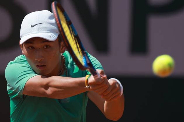 (230529) -- PARIS, May 29, 2023 -- Shang Juncheng of China returns the ball during the men s singles first round match against Juan Pablo Varillas of Peru at the French Open tennis tournament at Roland Garros in Paris, France, May 29, 2023. ) (SP)FRANCE-PARIS-TENNIS-ROLAND GARROS-FRENCH OPEN-MEN S SINGLES GaoxJing 