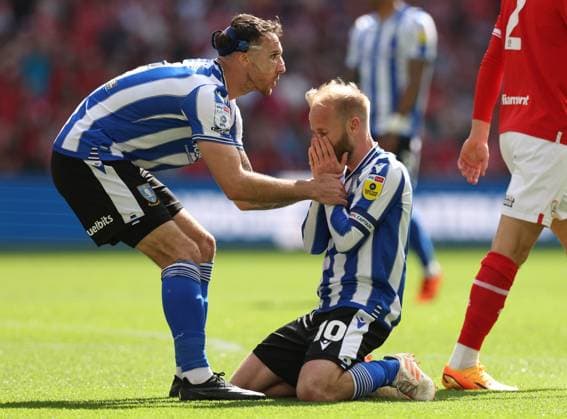 London, England, 29th May 2023. Lee Gregory of Sheffield Wednesday helps Barry Bannan of Sheffield Wednesday after he shot over the bar during the Sky Bet League 1 match at Wembley Stadium, London. Picture credit should read: David Klein Sportimage EDITORIAL USE ONLY. No use with unauthorised audio, video, data, fixture lists, club league logos or live services. Online in-match use limited to 120 images, no video emulation. No use in betting, games or single club league player publications. SPI-2469-0016