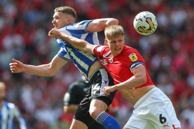 Sky Bet League 1 Play-off Final Barnsley v Sheffield Wednesday Michael Smith 24 of Sheffield Wednesday and Mads Juel Andersen 6 of Barnsley battle for the ball during the Sky Bet League 1 Play-off Final match Barnsley vs Sheffield Wednesday at Wembley Stadium, London, United Kingdom, 29th May 2023 (Photo by Gareth Evans News Images) London Wembley Stadium Greater London United Kingdom Copyright: xGarethxEvans NewsxImagesx