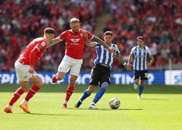 29th May 2023; Wembley Stadium, London, England; EFL League One Play Off Football Final, Barnsley versus Sheffield Wednesday; James Norwood of Barnsley challenges Marvin Johnson of Sheffield Wednesday  ActionPlus12515568 JohnxPatrickxFletcher