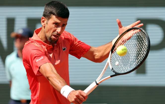 Serbian Novak Djokovic returns the ball to Aleksandar Kovacevic of the US during their first-round match at Roland Garros French Tennis Open in Paris, France, on Monday, May 29, 2023. Djokovic won 6-3, 6-2, 7-6.  PAR20230529519 MAYAxVIDON-WHITE