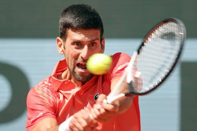 Serbian Novak Djokovic returns the ball to Aleksandar Kovacevic of the US during their first-round match at Roland Garros French Tennis Open in Paris, France, on Monday, May 29, 2023. Djokovic won 6-3, 6-2, 7-6.  PAR20230529521 MAYAxVIDON-WHITE