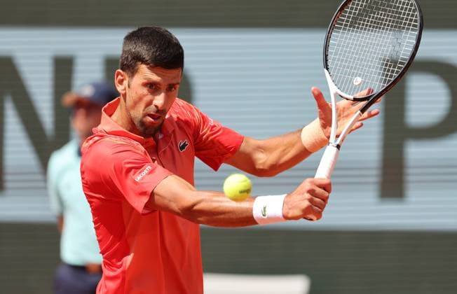 Serbian Novak Djokovic returns the ball to Aleksandar Kovacevic of the US during their first-round match at Roland Garros French Tennis Open in Paris, France, on Monday, May 29, 2023. Djokovic won 6-3, 6-2, 7-6.  PAR20230529518 MAYAxVIDON-WHITE