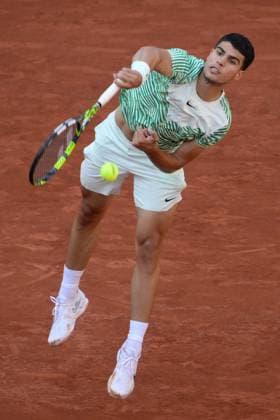 (230530) -- PARIS, May 30, 2023 -- Carlos Alcaraz of Spain serves during the men s singles first round match between Carlos Alcaraz of Spain and Flavio Cobolli of Italy at the French Open tennis tournament at Roland Garros in Paris, France, on May 29, 2023. (Photo by Xinhua) (SP)FRANCE-PARIS-TENNIS-ROLAND GARROS-FRENCH OPEN-MEN S SINGLES JulienxMattia 