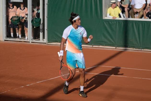 (230530) -- PARIS, May 30, 2023 -- Zhang Zhizhen of China celebrates during the men s singles first round match against Susan Lajovic of Serbia at the French Open tennis tournament at Roland Garros in Paris, France, May 29, 2023. (Photo by Xinhua) (SP)FRANCE-PARIS-TENNIS-ROLAND GARROS-FRENCH OPEN-MEN S SINGLES JulienxMattia 