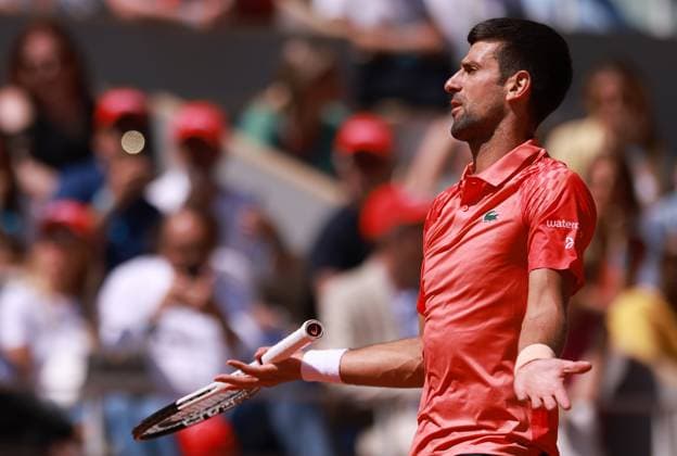 (230530) -- PARIS, May 30, 2023 -- Novak Djokovic of Serbia reacts during the men s singles first round match between Novak Djokovic of Serbia and Aleksandar Kovacevic of the United States at the French Open tennis tournament at Roland Garros in Paris, France, on May 29, 2023. ) (SP)FRANCE-PARIS-TENNIS-ROLAND GARROS-FRENCH OPEN-MEN S SINGLES GaoxJing 
