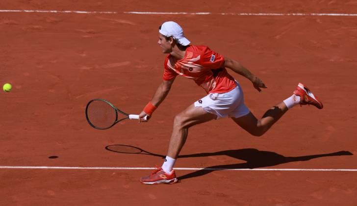 (230530) -- PARIS, May 30, 2023 -- Aleksandar Kovacevic of the United States returns the ball during the men s singles first round match between Novak Djokovic of Serbia and Aleksandar Kovacevic of the United States at the French Open tennis tournament at Roland Garros in Paris, France, on May 29, 2023. ) (SP)FRANCE-PARIS-TENNIS-ROLAND GARROS-FRENCH OPEN-MEN S SINGLES GaoxJing 
