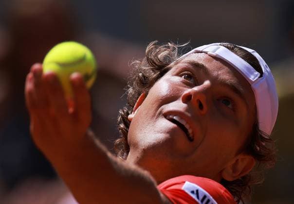 (230530) -- PARIS, May 30, 2023 -- Aleksandar Kovacevic of the United States serves during the men s singles first round match between Novak Djokovic of Serbia and Aleksandar Kovacevic of the United States at the French Open tennis tournament at Roland Garros in Paris, France, on May 29, 2023. ) (SP)FRANCE-PARIS-TENNIS-ROLAND GARROS-FRENCH OPEN-MEN S SINGLES GaoxJing 