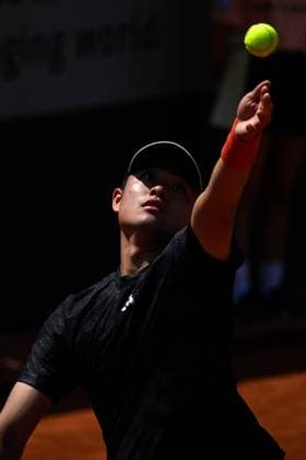 (230530) -- PARIS, May 30, 2023 -- Wu Yibing of China serves during the men s singles first round match against Roberto Bautista Agut of Spain at the French Open tennis tournament at Roland Garros in Paris, France, May 29, 2023. (Photo by Xinhua) (SP)FRANCE-PARIS-TENNIS-ROLAND GARROS-FRENCH OPEN-MEN S SINGLES JulienxMattia 