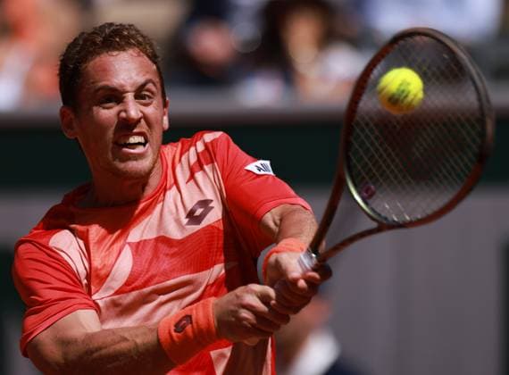(230531) -- PARIS, May 31, 2023 -- Roberto Carballes Baena hits a return during the men s singles second round match between Stefanos Tsitsipas of Greece and Roberto Carballes Baena of Spain at the French Open tennis tournament at Roland Garros in Paris, France, May 31, 2023. ) (SP)FRANCE-PARIS-TENNIS-ROLAND GARROS-FRENCH OPEN-MEN S SINGLES GaoxJing 