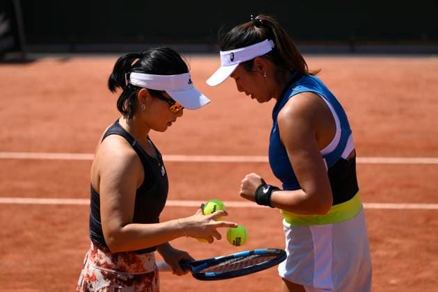 (230602) -- PARIS, June 2, 2023 -- Xu Yifan (L) Yang Zhaoxuan of China compete during the women s doubles first round match between Xu Yifan Yang Zhaoxuan of China and Zhu Lin of China Rebecca Marino of Canada at the French Open tennis tournament at Roland Garros in Paris, France, on June 1, 2023. (Photo by Xinhua) (SP)FRANCE-PARIS-TENNIS-ROLAND GARROS-FRENCH OPEN JulienxMattia 