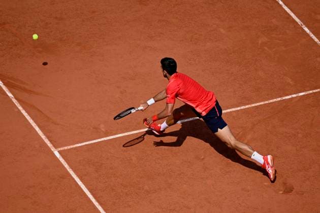 (230607) -- PARIS, June 7, 2023 -- Novak Djokovic competes during the men s singles quarterfinal match between Novak Djokovic of Serbia and Karen Khachanov of Russia at the French Open tennis tournament at Roland Garros in Paris, France, on June 6, 2023. (Photo by Xinhua) (SP)FRANCE-PARIS-TENNIS-ROLAND GARROS-FRENCH OPEN-MEN S SINGLES JulienxMattia 
