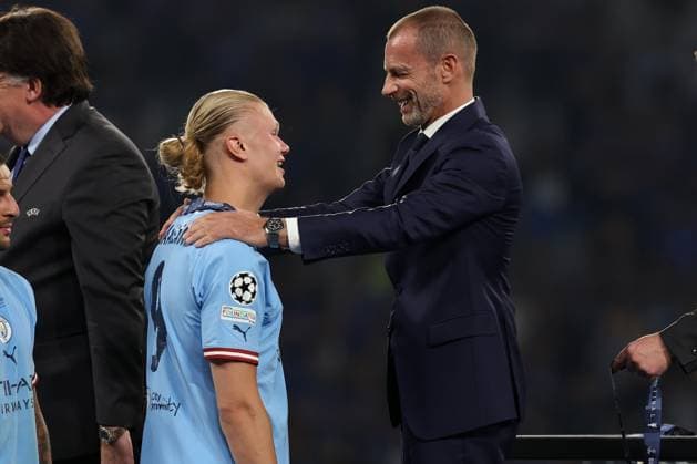 10th June 2023, Ataturk Olympic Stadium, Istanbul, Turkey; UEFA Champions League Final, Manchester City versus Inter Milan; Erling Haaland of Manchester City is presented with his winners medal by Uefa President Aleksander Ceferin  ActionPlus12518922 ShaunxBrooks