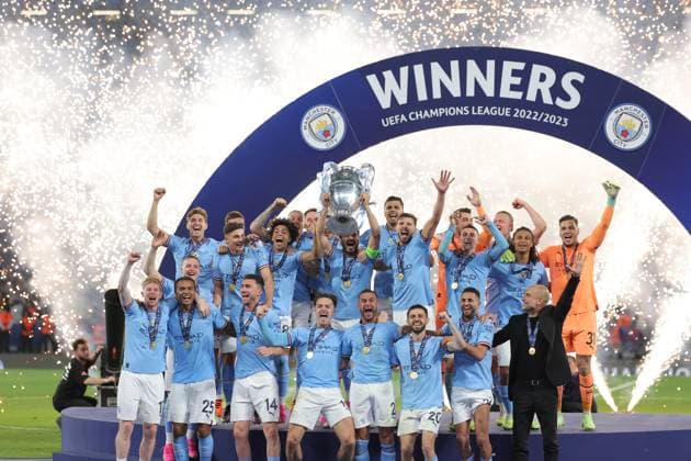 (230611) -- ISTANBUL, June 11, 2023 -- Team members of Manchester City celebrate with the trophy after winning the UEFA Champions League final between Manchester City and Inter Milan at Istanbul s Ataturk Olympic Stadium in Istanbul, T¨¹rkiye, on June 10, 2023. (SP)T?RKIYE-ISTANBUL-FOOTBALL-UEFA CHAMPIONS LEAGUE 2023-FINAL OmerxKuscu 