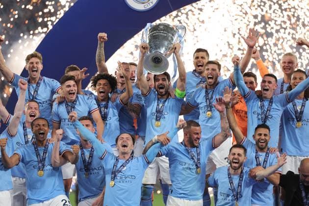 (230611) -- ISTANBUL, June 11, 2023 -- Team members of Manchester City celebrate with the trophy after winning the UEFA Champions League final between Manchester City and Inter Milan at Istanbul s Ataturk Olympic Stadium in Istanbul, T¨¹rkiye, on June 10, 2023. (SP)T?RKIYE-ISTANBUL-FOOTBALL-UEFA CHAMPIONS LEAGUE 2023-FINAL OmerxKuscu 