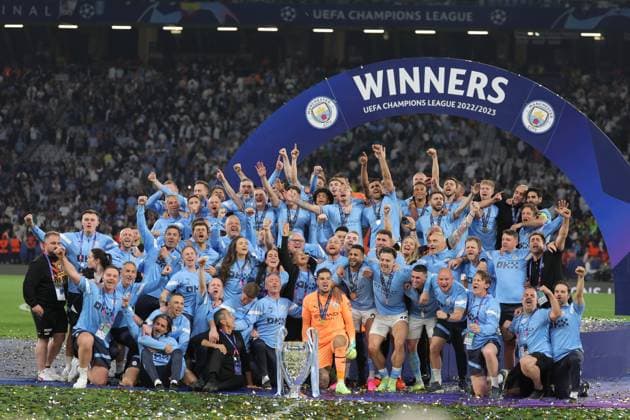 (230611) -- ISTANBUL, June 11, 2023 -- Team members of Manchester City pose for a group photo with the trophy after winning the UEFA Champions League final between Manchester City and Inter Milan at Istanbul s Ataturk Olympic Stadium in Istanbul, T¨¹rkiye, on June 10, 2023. (SP)T?RKIYE-ISTANBUL-FOOTBALL-UEFA CHAMPIONS LEAGUE 2023-FINAL OmerxKuscu 